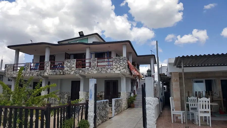 The front of a two-storey hostel in Playa Larga, Cuba.