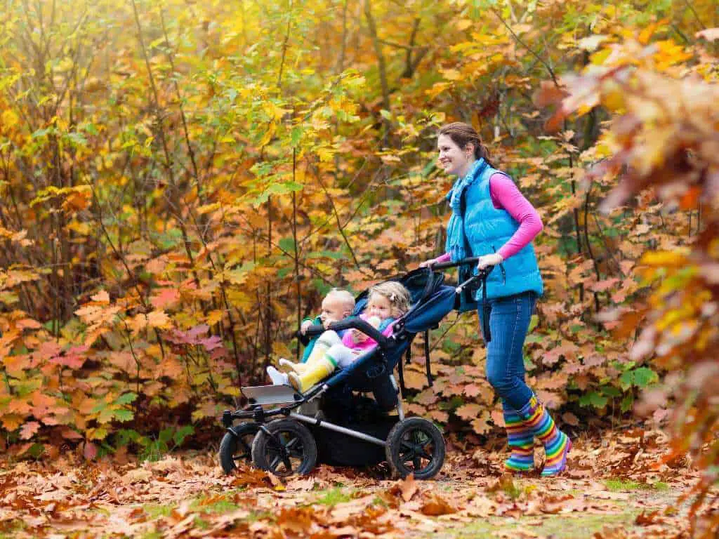 Mummy pushing an all terrain double stroller