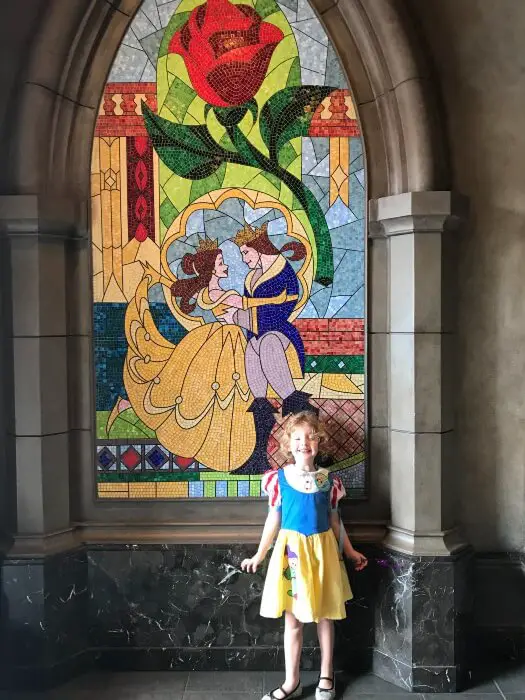 child taking a picture in snow white costume