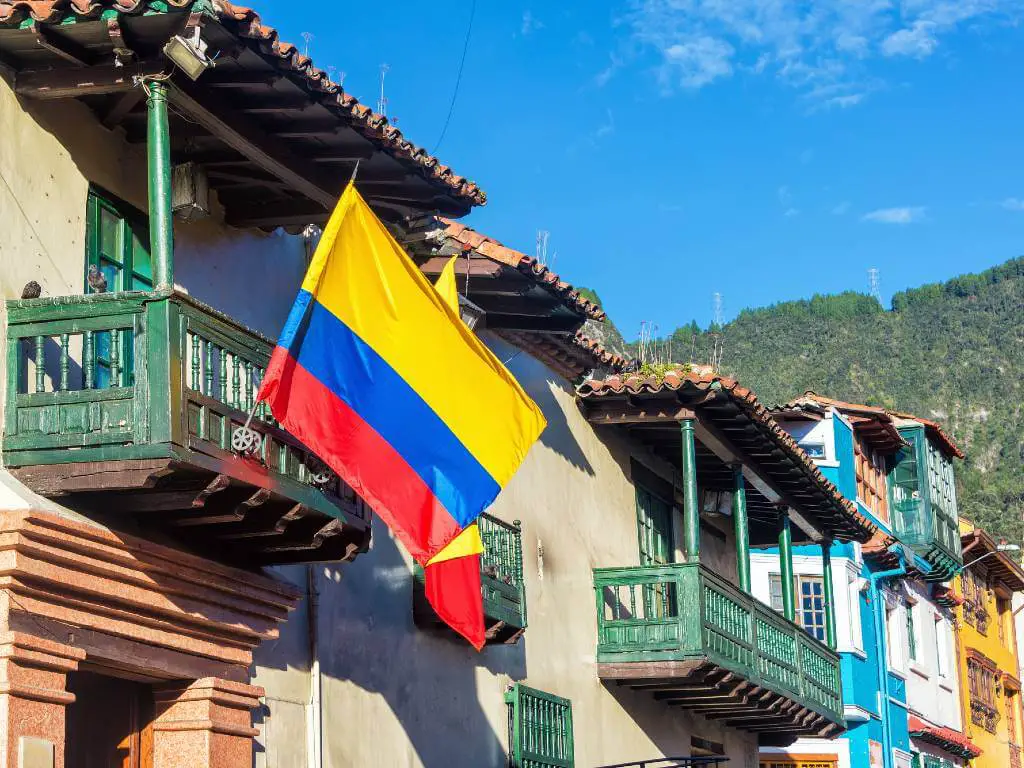 A Colombian flag hanging by the balcony of one of the best places in your Colombia itinerary 7 days