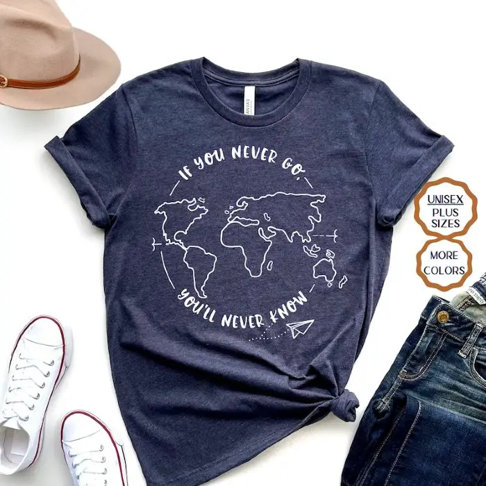 A dark coloured shirt with white print of a world map and text