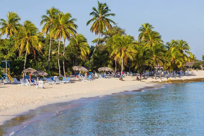 Guardalavaca beach with sunloungers and umbrellas