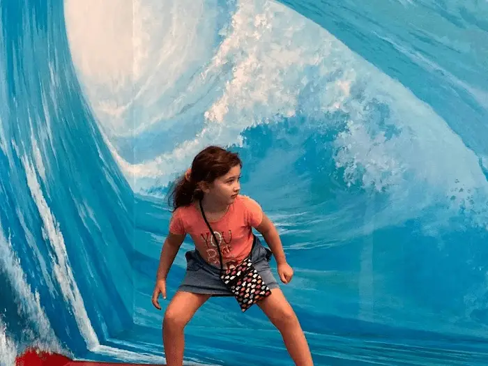 girl surfing in 3d museum in Chiang Mai, Thailand