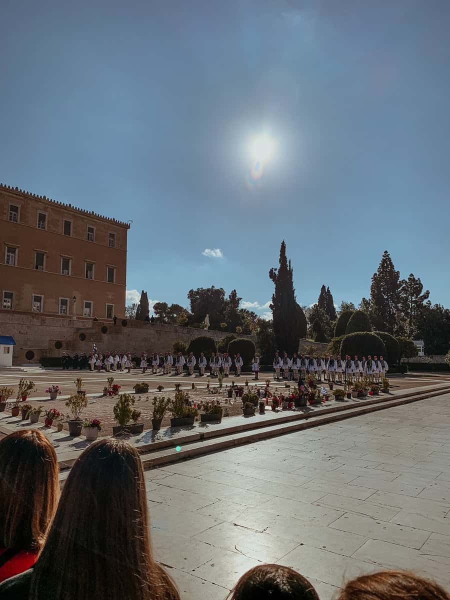 Watching the lined-up Evzones during the ceremony.