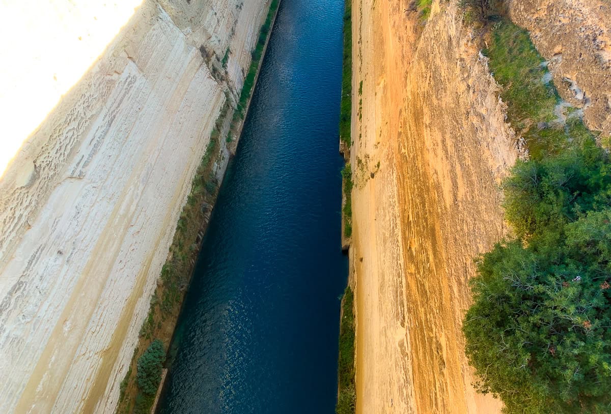 Steep beige cliffs and a narrow river.