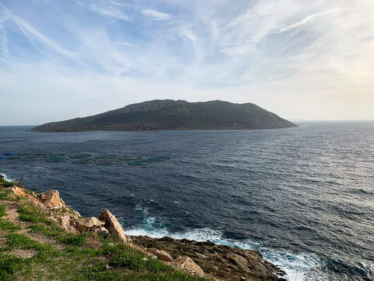 An island in the background near the Temple of Poseidon.