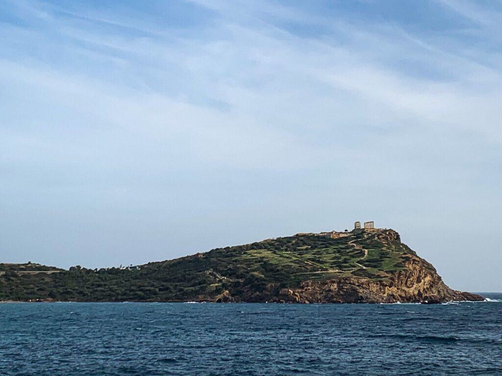 The island of Temple of Poseidon from afar.