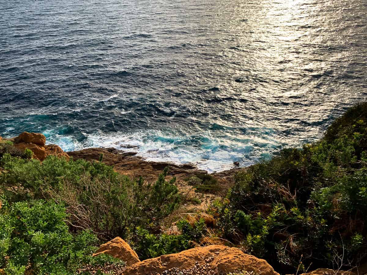 Rocky cliff near the blue waters.