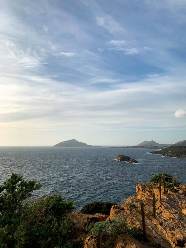 Islands from afar under the blue skies and view of the cliff.