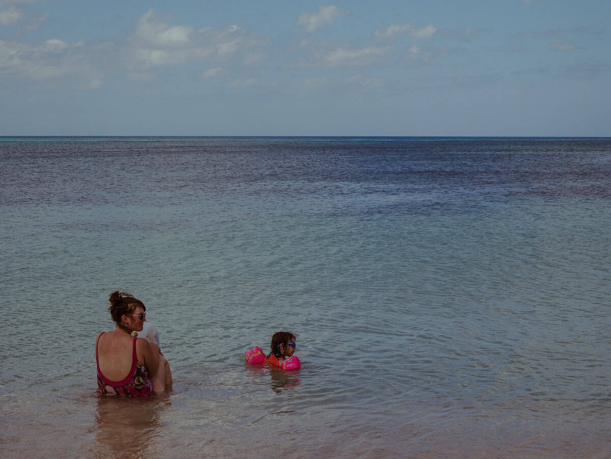 Babs and our daughter Norah are having fun together in the ocean.
