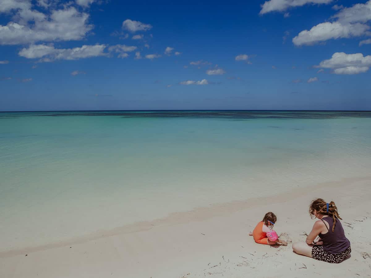 Kath and our daughter Norah are having fun while playing on the sandy beach.
