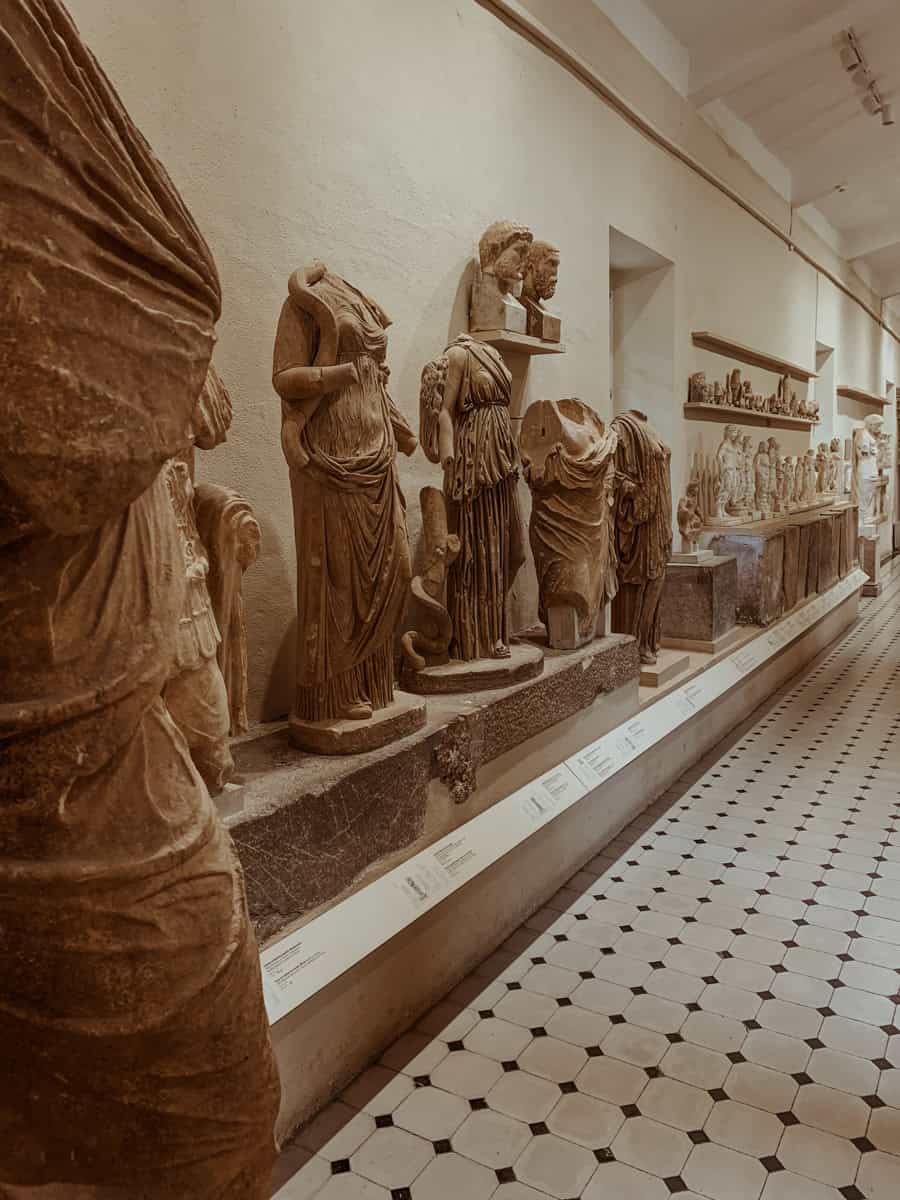 A row of ancient, headless stone statues was displayed inside the museum.