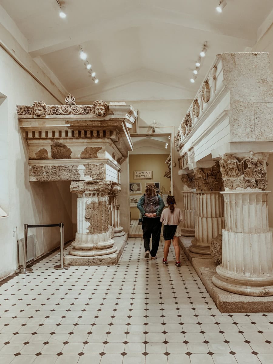 Kath, Norah, and Oscar inside the Epidaurus Museum.