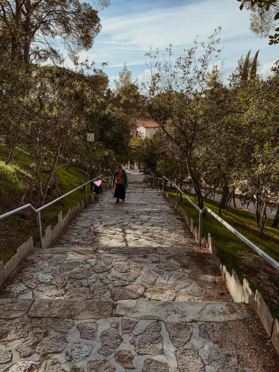 Babs and Oscar walking up the steps leading to the Ancient Theatre of Epidaurus.