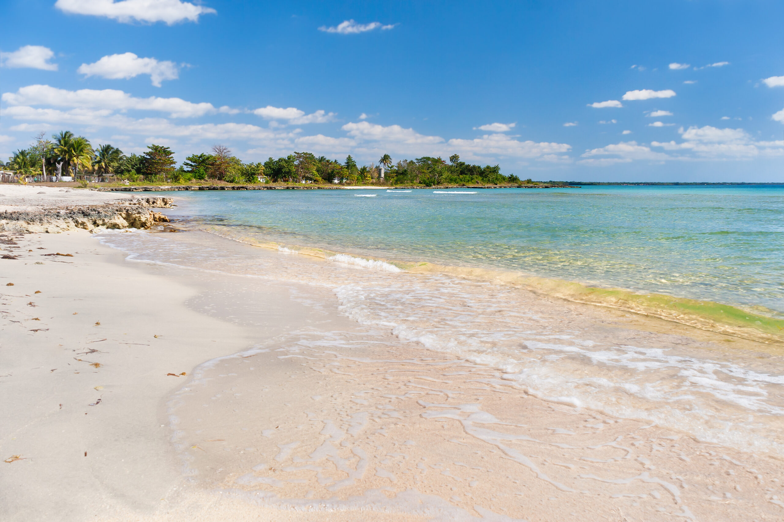 A tropical beach with clear turquoise water in Varadero, Cuba.