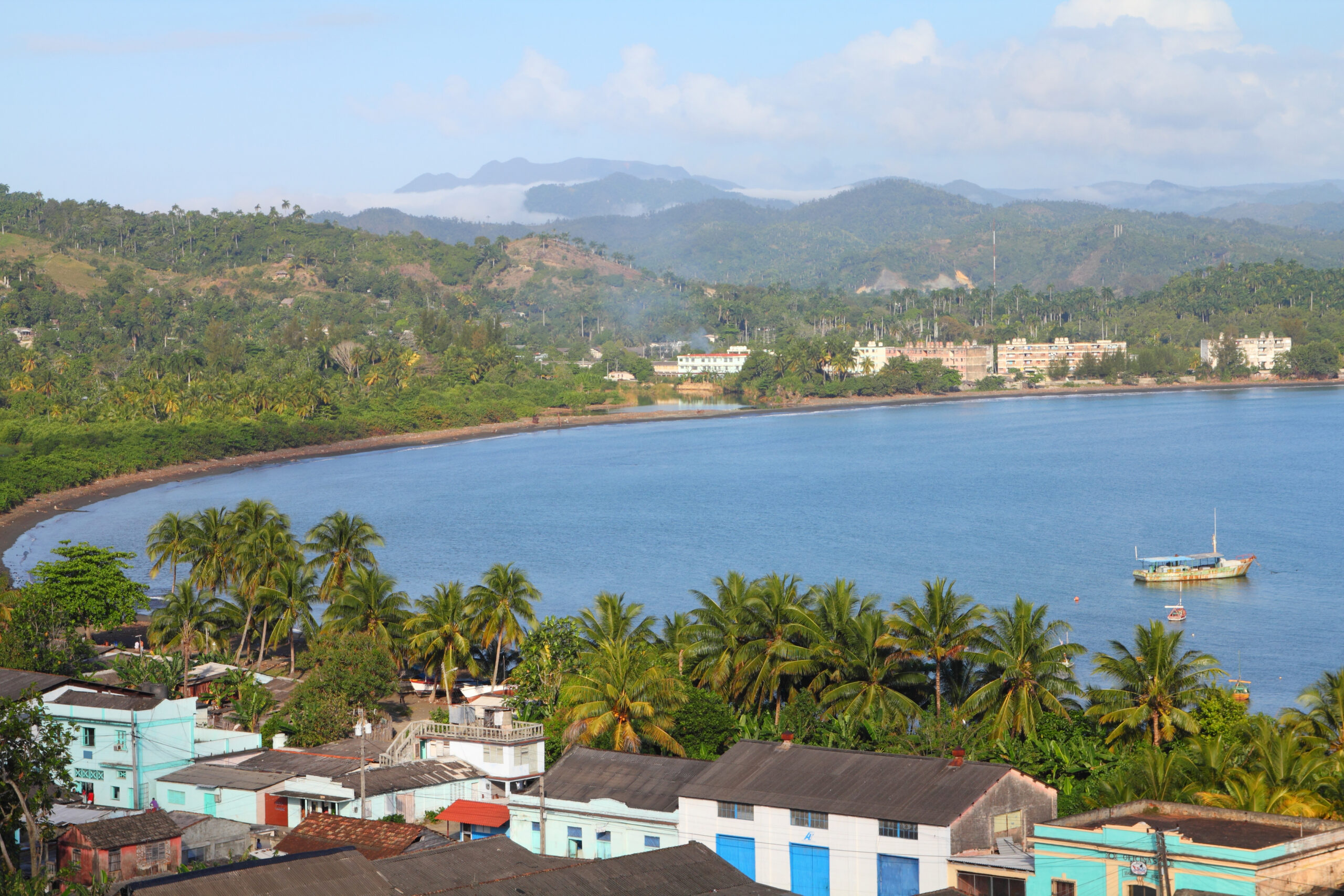An elevated view of Baracoa, Cuba, with its curved sea bay.